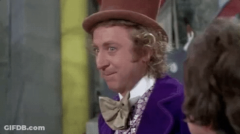 A Man Wearing A Top Hat And Bow Tie Is Smiling . GIF