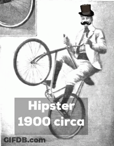 A Man Wearing A Top Hat Is Riding A Bicycle With The Words Hipster 1900 Circa Below Him GIF