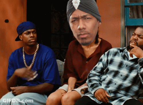 A Man Wearing A Turban Sits With Two Other Men GIF