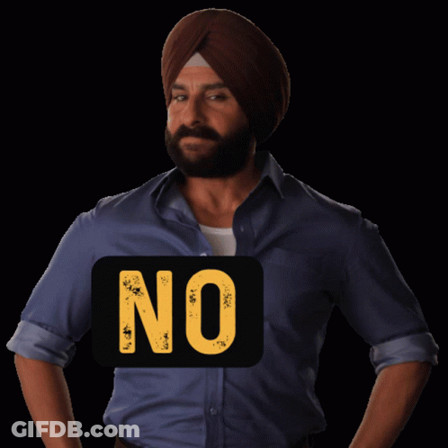 A Man Wearing A Turban Stands In Front Of A Sign That Says " No " GIF