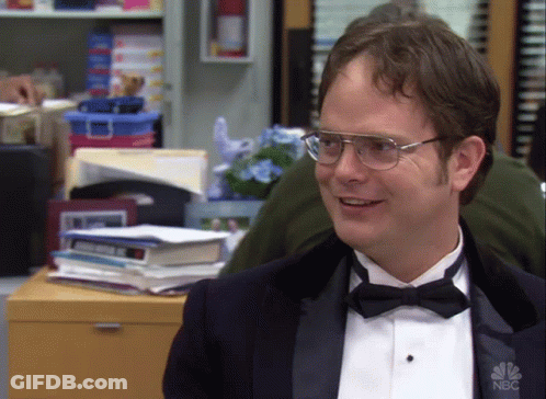 A Man Wearing A Tuxedo And Bow Tie Has A Nbc Logo On His Shirt GIF