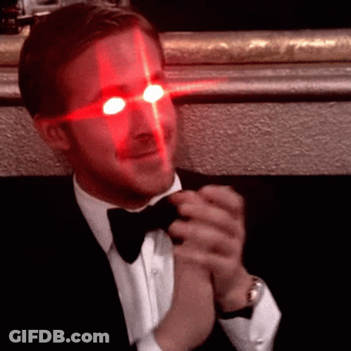 Man In Tuxedo With Red Eyes GIF