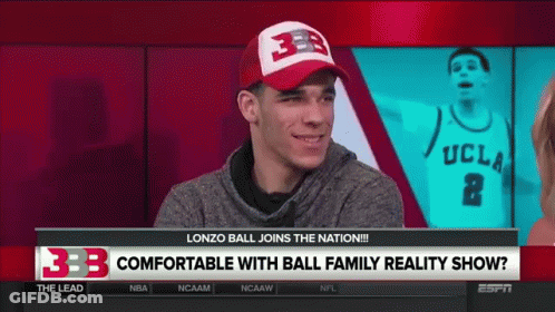 A Man Wearing A Ucla Jersey Is Talking To A Woman On A Tv Show GIF