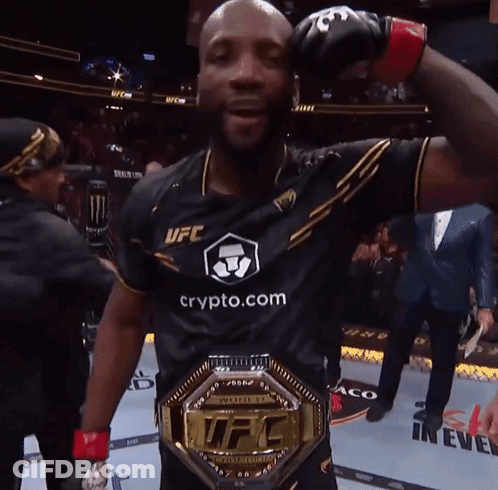 A Man Wearing A Ufc Shirt And A Ufc Championship Belt GIF