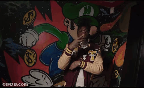 A Man Wearing A Varsity Jacket With The Letter F On The Sleeve GIF