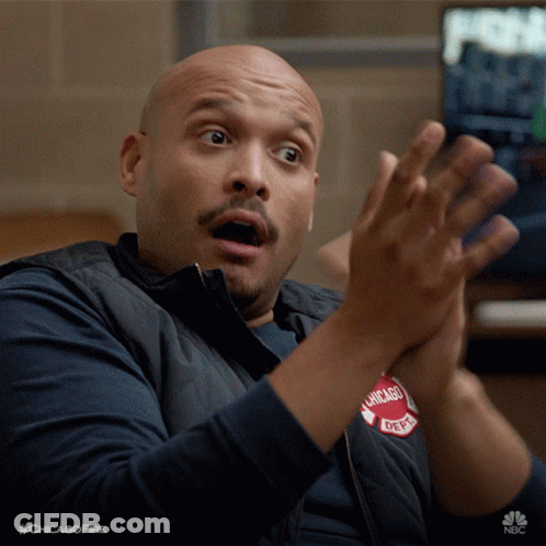 A Man Wearing A Vest That Says Chicago Fire On It GIF