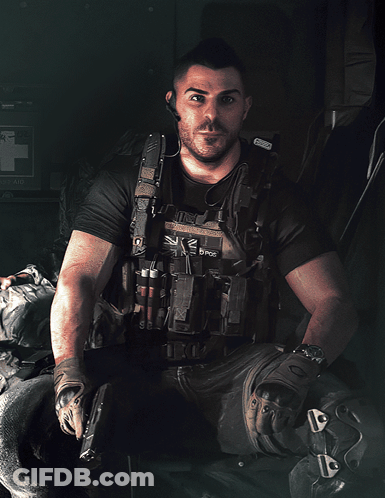 A Man Wearing A Vest That Says ' K2 D Pos ' On It GIF