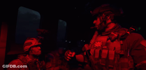 A Man Wearing A Vest That Says Pvb On It GIF
