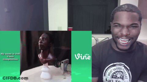 A Man Wearing A Vine T-Shirt Is Laughing GIF