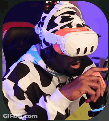 A Man Wearing A Virtual Reality Headset And A Cow Print Hat GIF