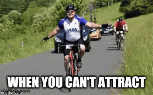 A Man Wearing A Visa Shirt Is Riding A Bike On A Road GIF