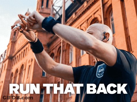 A Man Wearing A Volvo Shirt Holds His Hands In The Air GIF