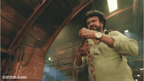 A Man Wearing A Watch Holds A Chain In His Hand GIF