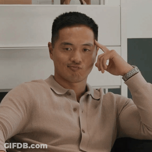 A Man Wearing A Watch Holds His Hand To His Head GIF