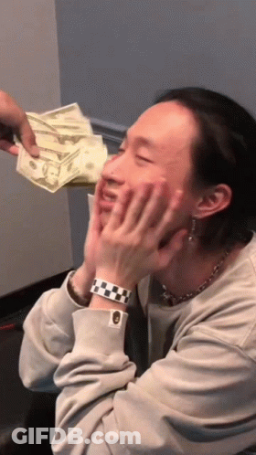 A Man Wearing A Watch Is Being Handed A Stack Of Money GIF