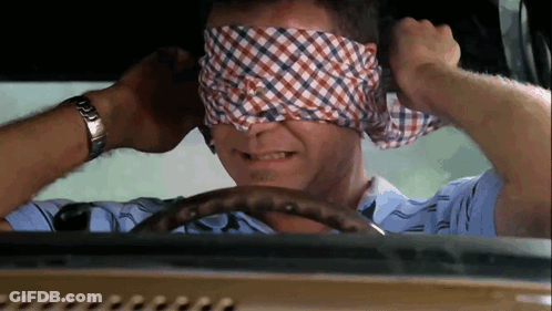 A Man Wearing A Watch Is Blindfolded While Driving GIF