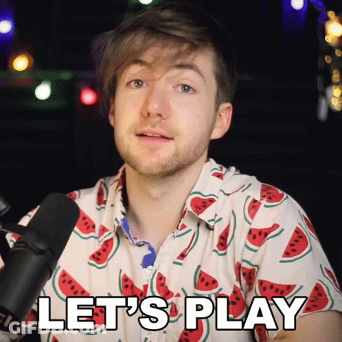 A Man Wearing A Watermelon Shirt Says " Let 'S Play " GIF