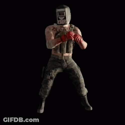 A Man Wearing A Welding Helmet Is Holding A Bunch Of Bombs In His Hands . GIF