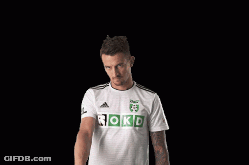 A Man Wearing A White Adidas Shirt With Rokd On It GIF