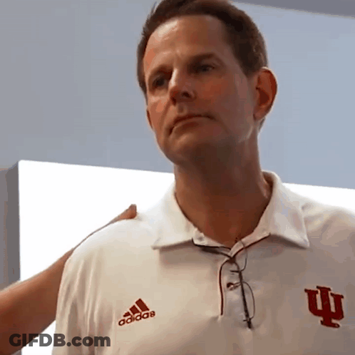 A Man Wearing A White Adidas Shirt With The Letter I On The Front GIF