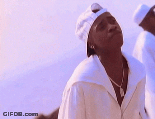 A Man Wearing A White Baseball Cap And A White Shirt GIF