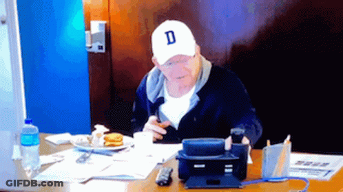 A Man Wearing A White Cap With The Letter D On It GIF