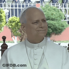 A Man Wearing A White Collared Shirt And A White Hat GIF