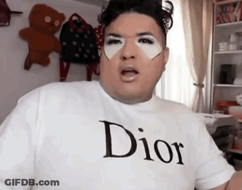 A Man Wearing A White Dior T-Shirt Is Making A Face GIF