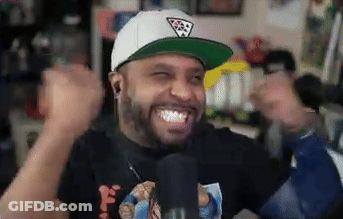 A Man Wearing A White Hat And A Black Shirt Is Making A Funny Face GIF