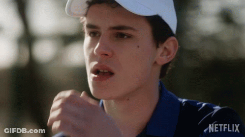 A Man Wearing A White Hat And A Blue Shirt With Netflix Written On The Bottom GIF