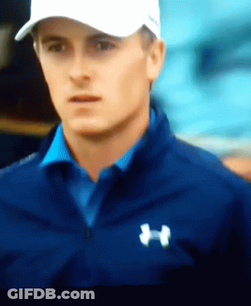 A Man Wearing A White Hat And A Blue Under Armour Shirt GIF