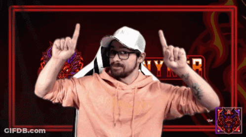 A Man Wearing A White Hat And A Pink Hoodie With The Word Nyr In The Background GIF