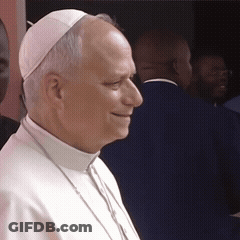 A Man Wearing A White Hat And Collared Shirt GIF