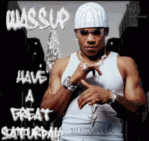 A Man Wearing A White Hat And Sunglasses Is Standing In Front Of A Sign That Says Have A Great Saturday GIF