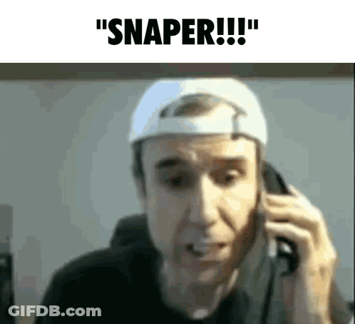 A Man Wearing A White Hat Is Talking On A Cell Phone And Says Snaper GIF