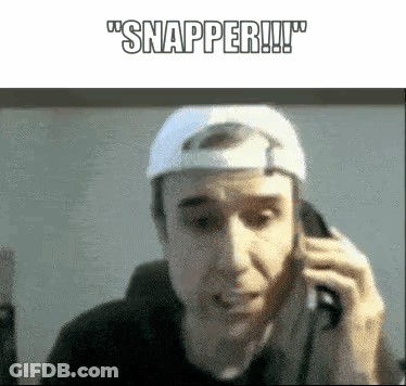 A Man Wearing A White Hat Is Talking On A Cell Phone And Says Snapper GIF