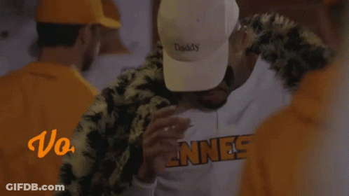 A Man Wearing A White Hat That Says " Daddy " GIF