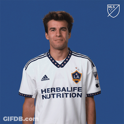 A Man Wearing A White Herbalife Nutrition Shirt GIF