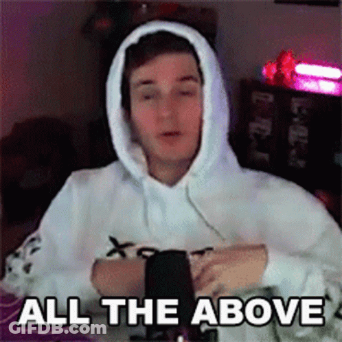 A Man Wearing A White Hoodie Is Sitting In Front Of A Microphone And Says `` All The Above '' . GIF