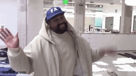 A Man Wearing A White Jacket And A Blue Hat With Fa On It GIF