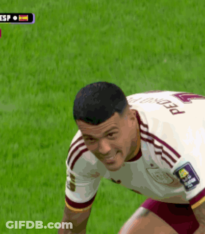 A Man Wearing A White Jersey With The Number 12 On It GIF
