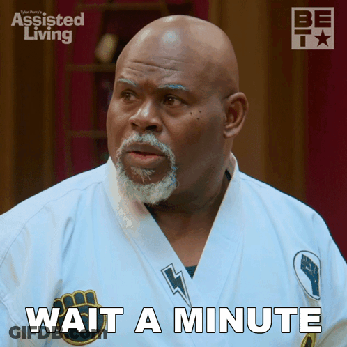 A Man Wearing A White Karate Uniform Says Wait A Minute GIF