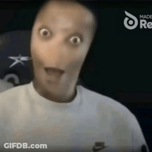 A Man Wearing A White Nike Sweatshirt Looks Surprised GIF