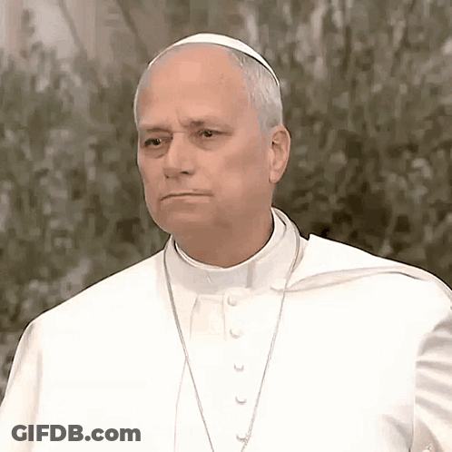 A Man Wearing A White Robe And A White Hat Looks Serious GIF