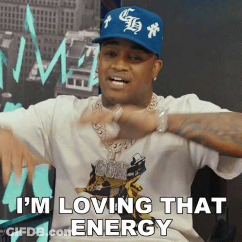 A Man Wearing A White Shirt And A Blue Hat Is Saying I 'M Loving That Energy GIF