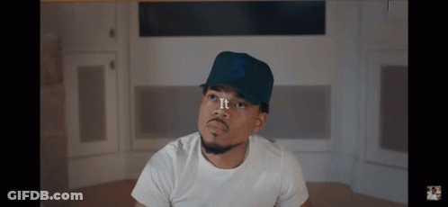 A Man Wearing A White Shirt And A Hat With The Number 3 On It GIF
