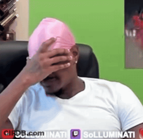 A Man Wearing A White Shirt And A Pink Hat Covering His Face GIF