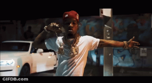 A Man Wearing A White Shirt And A Red Hat With The Letter G On It GIF