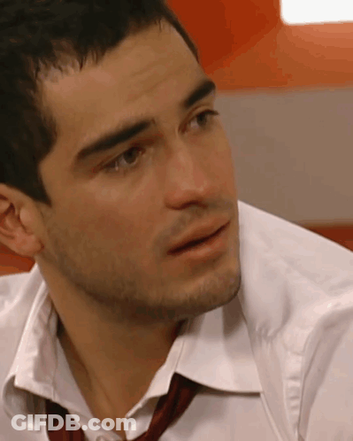 A Man Wearing A White Shirt And A Red Tie GIF