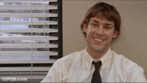 A Man Wearing A White Shirt And Tie Smiles In Front Of A Window GIF